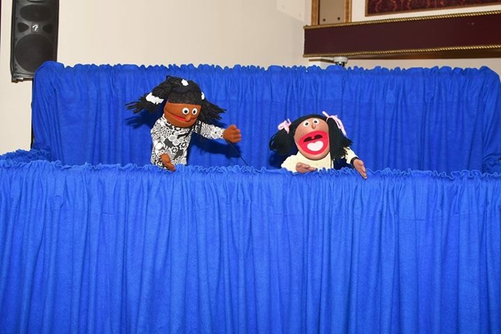 Two puppets performing